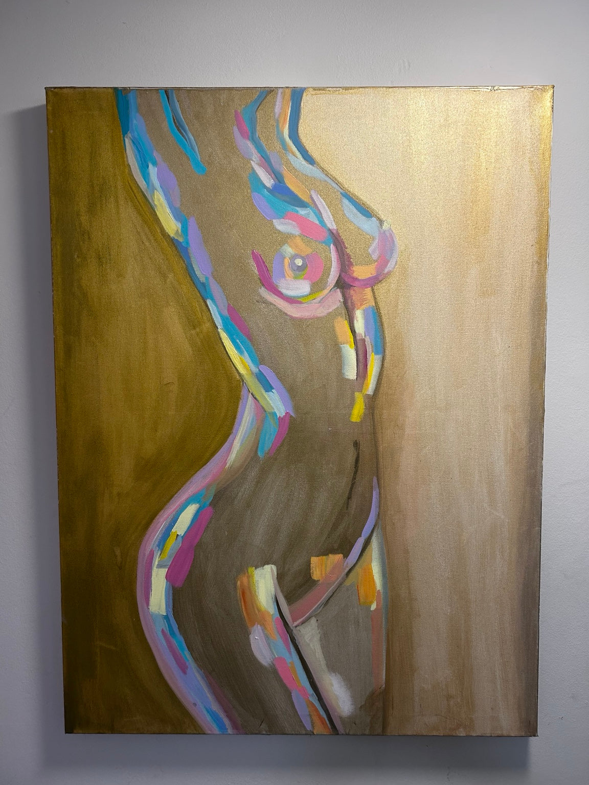 Fine art print of an abstract figure with colorful strokes on a golden background